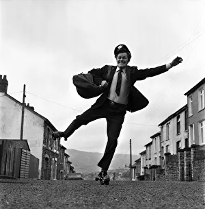 Fred Henderson, 49, makes speedy deliveries with the local post with balletic leaps along