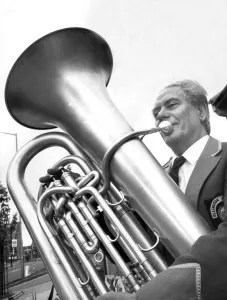 Fred Joicey playing the base tuba in a parade for the Ellington band in June 1987