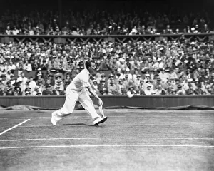 01236 Prints: Fred Perry competing at The Mens singles Wimbledon Championships in 1934 on the centre