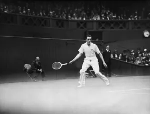 Fred Perry competing at The Mens singles Wimbledon Championships in 1934 on the centre