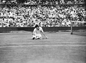 Grass Prints: Fred Perry (GB) on the floor during his 1934 mens semi final match against Sidney Wood