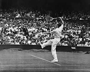Fred Perry (pictured) (GB) competing at The Wimbledon Tennis Championships against