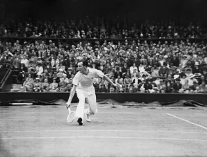 Grass Prints: Fred Perry (Right - GB) plays a low back hand at the net against John Van Ryn (Left - USA