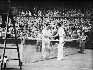 Fred Perry (Right - GB) shakes hands with John Van Ryn (Left - USA