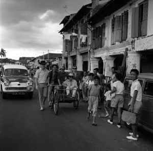 Freddie & the Dreamers pop group in Singapore March 1965 Riding along the street in