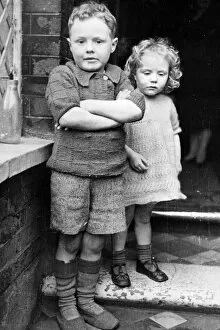 01448 Collection: Freddie Harrison, 6, and his sister Winifred, 3, whom he saved from the ruins of their