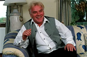 Freddie Starr Comedian / Actor June 1998 Sitting on blue