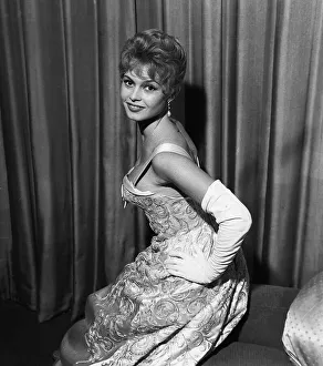 French actress Bridgitte Bardot rehearses her curtsy in anticipation of her meeing with