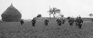 Haystack Prints: French cavalrymen dismounted seen here running across a corn field in Flanders
