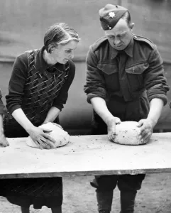 British B Prints: A French housewife lends a hand and gives hints on French cooking at the Army School of