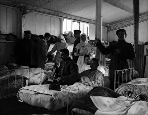 French soldiers entertaining wounded comarade in hospital during World War One