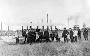Battle Prints: French soldiers stand next to an aeroplane in a field in France during World War One