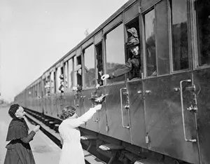 Pickelhaube Prints: Two French women seen here collecting money for the wounded from passengers in a train