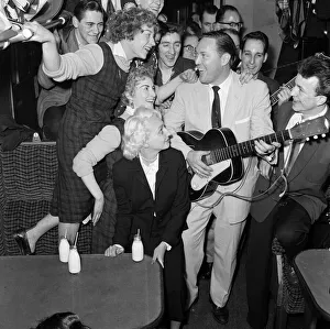 Frenzied scenes as American rock and roll singer Bill Haley arrives in London