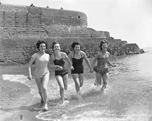 Friends enjoying some early summer sunshine on the south coast during the Whitsun Bank