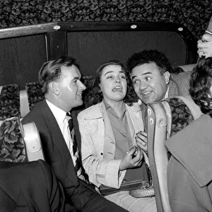 00091 Prints: Friends enjoying a joke and a laugh on a coach trip to Manchester. July 1955 A322-004