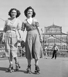 Skirt Prints: Friends rolling skating in the August sunshine at the Winter Gardens in Great Yarmouth