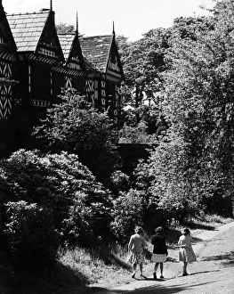 National Trust Prints: Three friends out for a walk at Speke Hall, the 16th century wood framed wattle