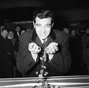 Frnakie Vaughan March 1962 with some of the coins collected for the silver mile