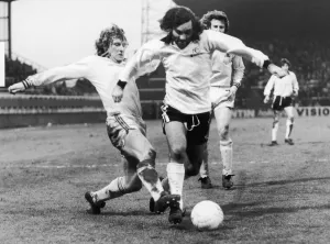 00326 Prints: Fulham v. Burnley. George Best of Fulham flies past Smith of Burnley