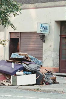Furniture piled on street outside business which has recently closed in East Berlin