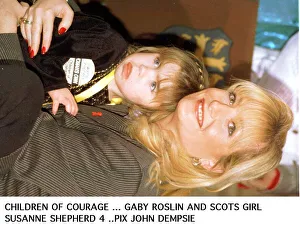 Gaby Roslin cuddles Suzanne Shephard - one of 1995 Children of courage the Ayrshire girl