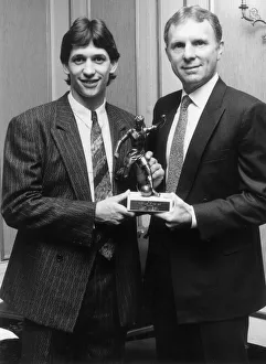 Gary Lineker receives his footballer of the year trophy drom Bobby Moore. 9th May 1986
