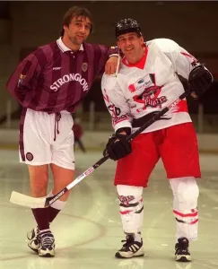 Hearts Prints: Gary Mackay of Hearts leaning on Paisley pirates Paul Hand on ice rink