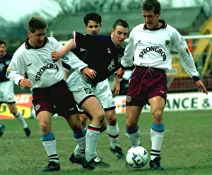 Gary Mackay and John Robertson of Hearts Football club hold off Alex Taylor of Raith