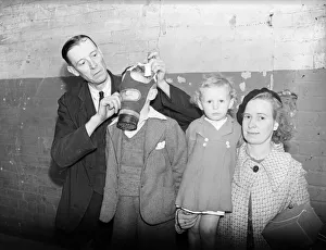 01465 Prints: Gas masks are distributed and fitted at the Broad Street offices of Birminghams A. R