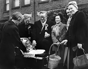 Rosette Prints: General Election 1950: Mr. and Mrs. Herbert Morrison chat with baby John Carlisle