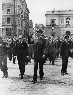 01449 Prints: General De Gaulle waves to the wildly cheering crowds of his countrymen as he