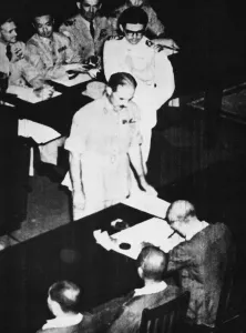 Surrender Prints: General Itagaki with Field Marshal Terauchi sign the absolute surrender of southern