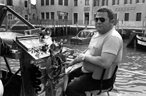 Sailor Prints: General scenes in Venice. Captain of a water taxi awaits his next fare