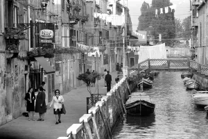 General scenes in Venice. Washing lines displaying their smalls stretch across one of
