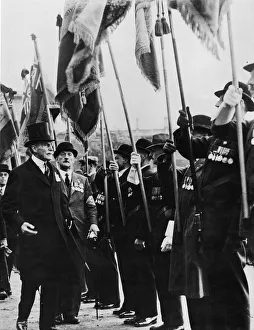 General Sir Ian Hamilton inspects the standard bearers at a British legion Memorial