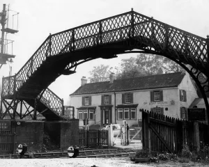 00399 Prints: A general view of The Boat House pub and footbridge from the platform of Wylam Railway
