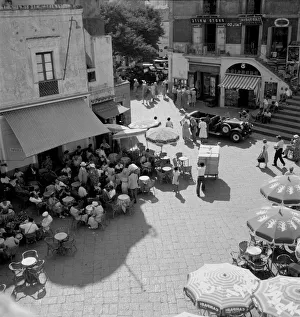 Umbrellas Prints: General view of the Piazza Umberto on Capri, Italy, the meeting place of all whom stay or