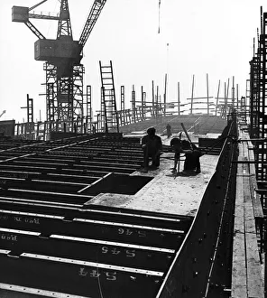 General view of Shipbuilders at work in a shipyard Circa 1955