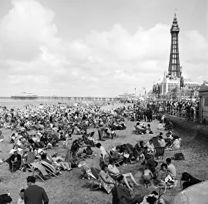 00115 Prints: General view showing busy scenes at Blackpool beach in the summer holidays