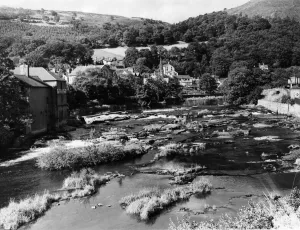 General view showing the River Dee as it meanders through the hill girdled town of
