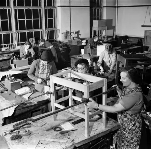 Skills Prints: A general view of the woodwork class showing 6 women to one male student at work