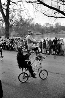 Easter Parades Prints: Gentleman in fancy dress seen here riding an unusual tandam bicycle in the Easter parade