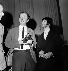 Geoffrey Emerick, an engineer at EMI gets an award from Ringo Starr March 1968