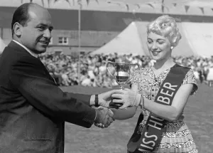 01410 Prints: Geoffrey Rootes presenting a sash and cup to Mrs Greenway who was chosen as Miss Humber