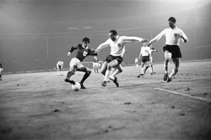 Three People Prints: George Best in action for Northern Ireland during the Home International match against