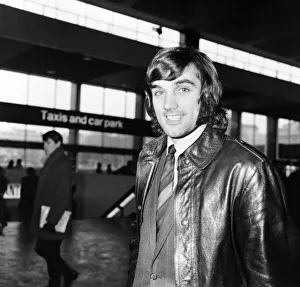 Leather Coat Prints: George Best arrives at Euston Station with members of Manchester United Football team for