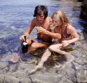 Wags Prints: George Best footballer with girlfriend Susan George on holiday in Majorca 1969