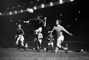 00222 Prints: George Best heads the ball clear December 1969 watched by Pat Crerand