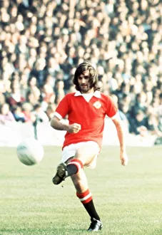 00242 Prints: George Best Manchester United Footballer kicking ball 1973